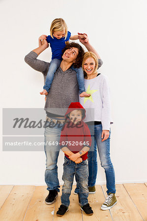 Studio portrait of couple together with son and daughter