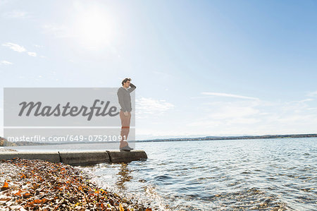 Man on jetty, Lake Starnberg, Bavaria, Germany