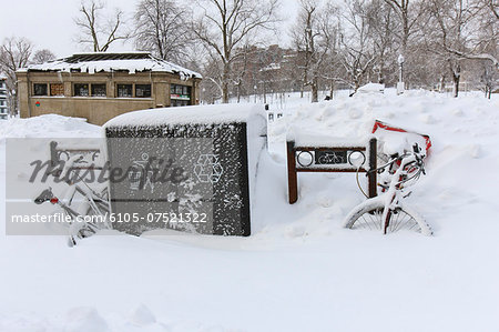 Bicycles at corner of streets during blizzard in Boston, Suffolk County, Massachusetts, USA