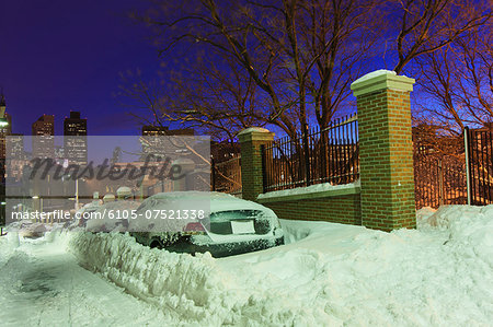 Car buried in snow on Snowhill Street after blizzard in Boston, Suffolk County, Massachusetts, USA