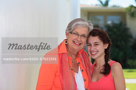 Senior woman smiling with her granddaughter