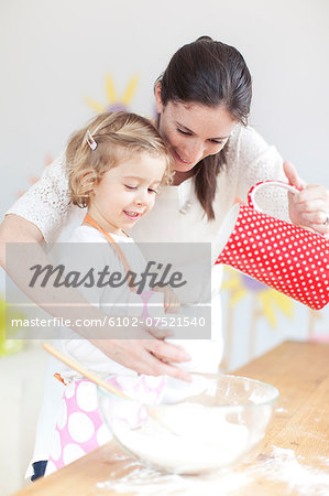 Mother baking with daughter, New York City, USA