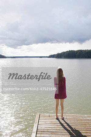 Girl looking at water, Skane, Sweden