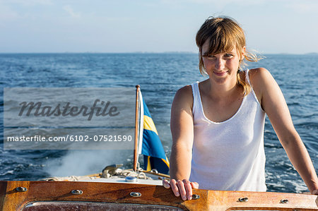 Young woman in boat, Sweden
