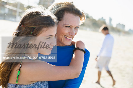 Mother with daughter on beach