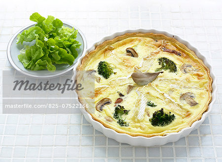 Camembert and broccoli savoury tart served with a lettuce salad