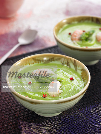 Cream of pea and green aspragus soup with Dublin Bay prawns