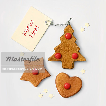Christmas cookies with red smarties and a Happy Christmas tag