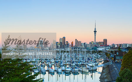 Westhaven Marina and city skyline illuminated at sunset, Waitemata Harbour, Auckland, North Island, New Zealand, Pacific Westhaven Marina and city skyline illuminated at sunset, Waitemata Harbour, Auckland, North Island, New Zealand, Pacific