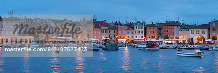 Panoramic image of the waterfront and harbour with ships and boats at dusk, Rovinj, Istria, Croatia, Europe