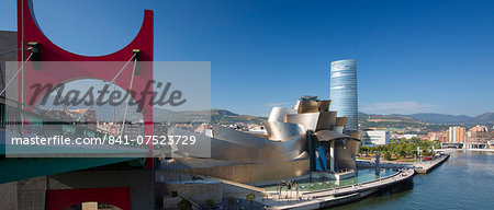Frank Gehry's Guggenheim Museum, Red Bridge - Principes de Espana Bridge, Iberdrola Tower and River Nervion at Bilbao, Spain Frank Gehry's Guggenheim Museum, Red Bridge - Principes de Espana Bridge, Iberdrola Tower and River Nervion at Bilbao, Spain
