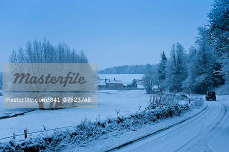 Traditional snow scene in a typical Cotswolds village, Swinbrook, Oxfordshire, United Kingdom