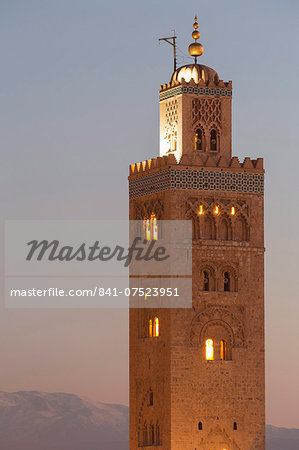 The Minaret of the Koutoubia Mosque, UNESCO World Heritage Site, at dusk with the Atlas mountains beyond, Marrakech, Morocco, North Africa, Africa The Minaret of the Koutoubia Mosque, UNESCO World Heritage Site, at dusk with the Atlas mountains beyond, Marrakech, Morocco, North Africa, Africa