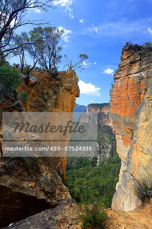 The magnificent sandstone vertical cliffs at Hanging Rock and Burramoko Head, Blue Mountains, NSW Australia.  Please note, this is NOT the Hanging Rock in Victoria.