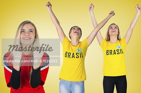 Composite image of football fans against yellow vignette