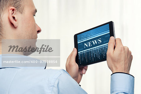 Man Holding Digital Tablet. News concept