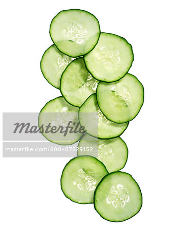 Cucumber slices on white background, studio shot Cucumber slices on white background, studio shot