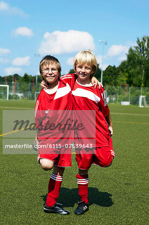 Two boys at soccer training, side by side, Munich, Germany