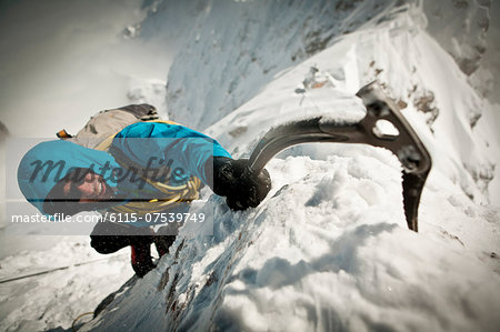 Alpinist ice climbing, on the rope, Zugspitze Mountain, Bavaria, Gerrmany