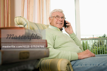 Senior man on the phone in nursing home, Bavaria, Germany