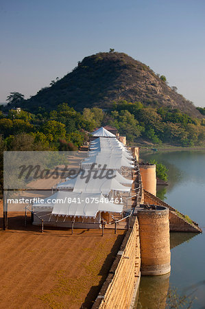 Chhatra Sagar reservoir and luxury tented camp oasis in the desert at Nimaj, Rajasthan, Northern India