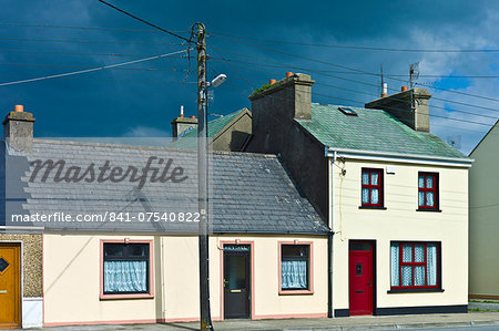 Street scene pastel painted terraced homes in Kilkee, County Clare, West of Ireland