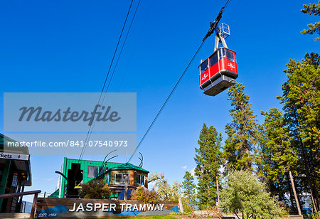 Red Gondola car on the Jasper tramway rising up Whistler mountain, Jasper National Park, Alberta, Canada, North America