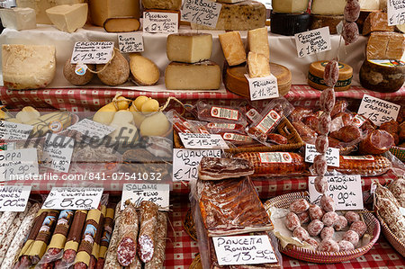 Cheese and salamis at Papiniano market, Milan, Lombardy, Italy, Europe