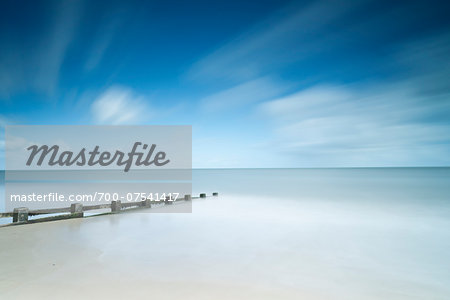 Long Exposure of Tide, Beach and Clouds in Summer, Dorset, England