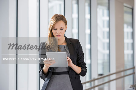 Businesswoman using tablet PC in office