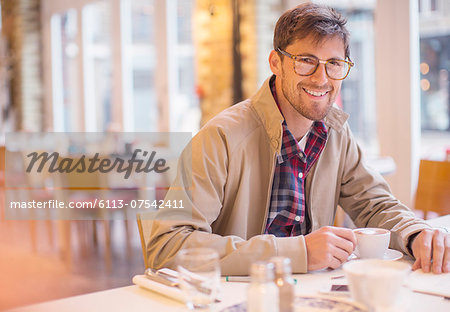 Man enjoying cup of coffee in cafe