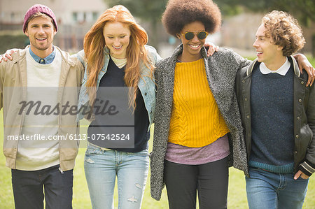 Friends walking together in park
