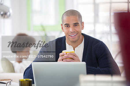 Man using laptop at table