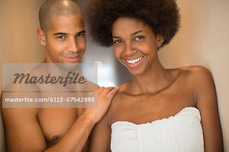 Couple smiling together in bathroom