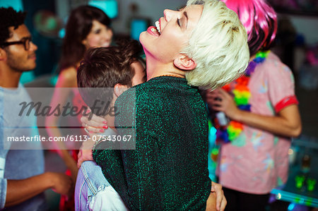 Couple dancing together at party