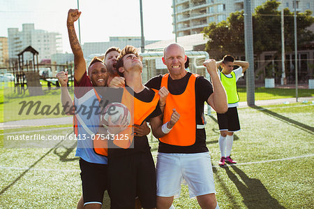 Soccer players cheering on field
