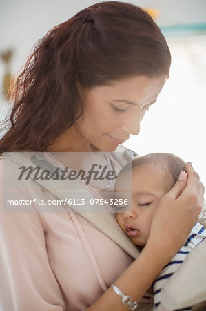 Mother holding baby girl