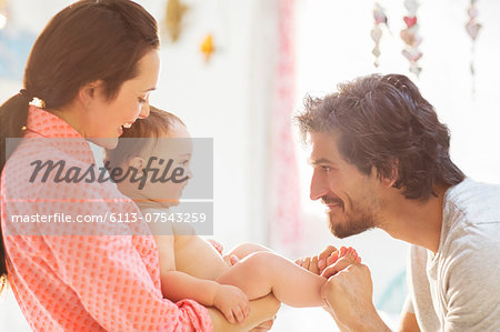 Parents playing with baby boy