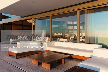 Sofas and table on modern balcony