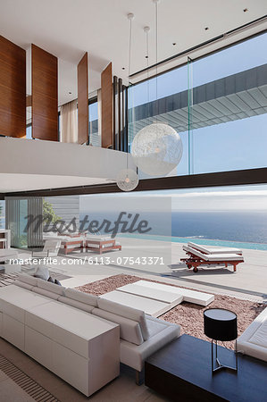 Living room in modern house overlooking ocean