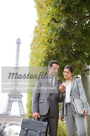 Business people talking near Eiffel Tower, Paris, France