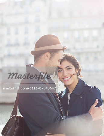 Couple hugging outdoors