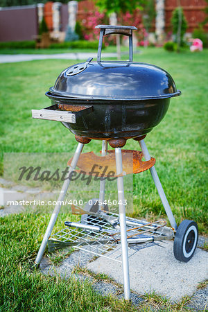 Grilling theme with barbecue stuff. Kettle barbecue grill.