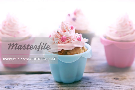 Photo of cute cupcakes with pink cream