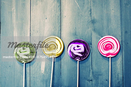 Photo of 4 lollipops on wooden