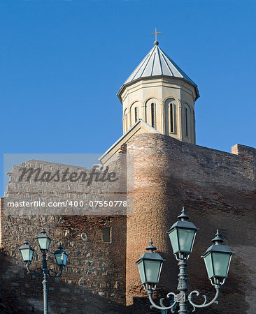 Old fortress is situated against the blue sky background. This is the Naricala fortress (Tbilisi, Georgia).