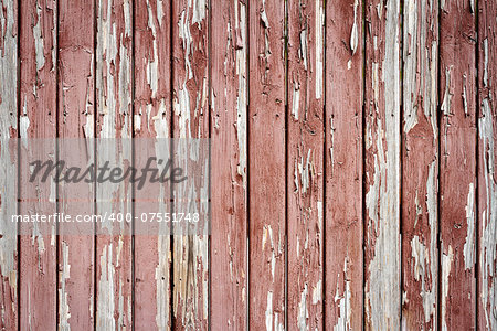 Peeling brown paint on weathered wood texture