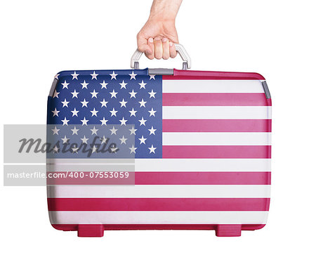 Used plastic suitcase with stains and scratches, printed with flag, United States of America