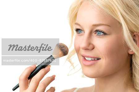 Closeup makeup applying of a blond woman