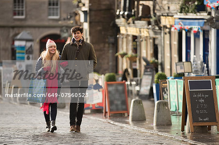 A young couple shop in the Grassmarket in Edinburgh, Scotland